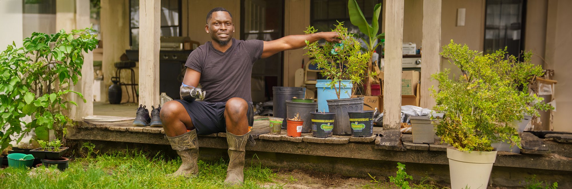 Xavier Collier on porch with plants